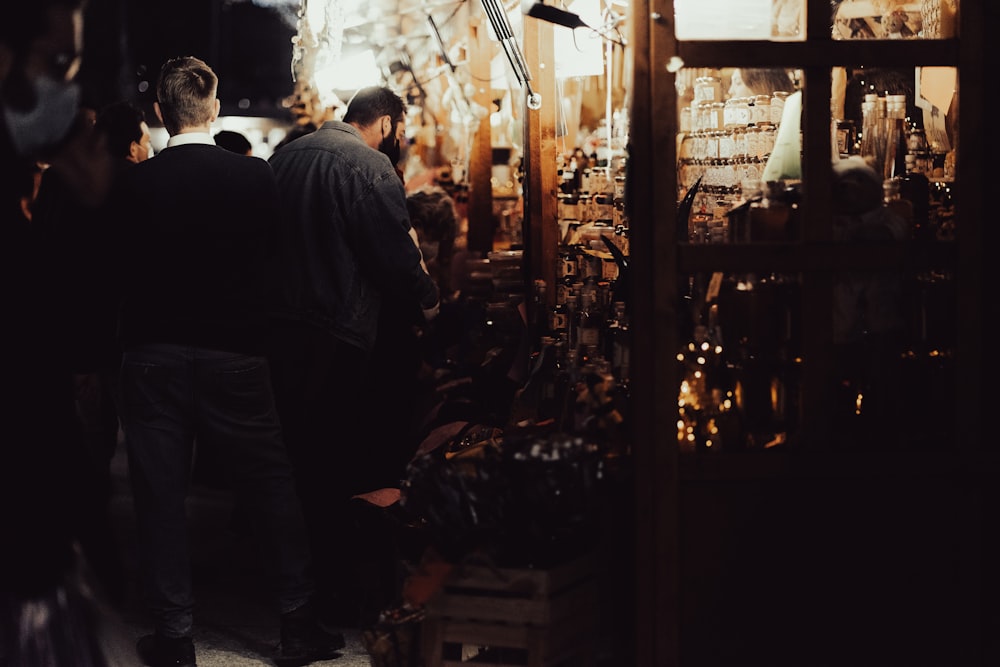 a group of people standing around a store