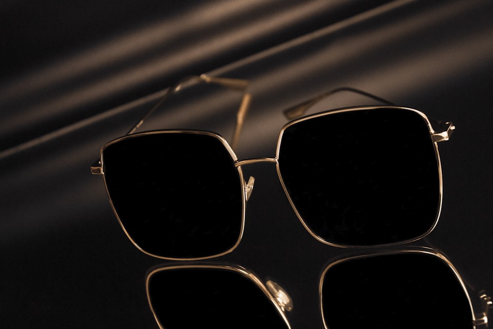 a pair of sunglasses sitting on top of a table