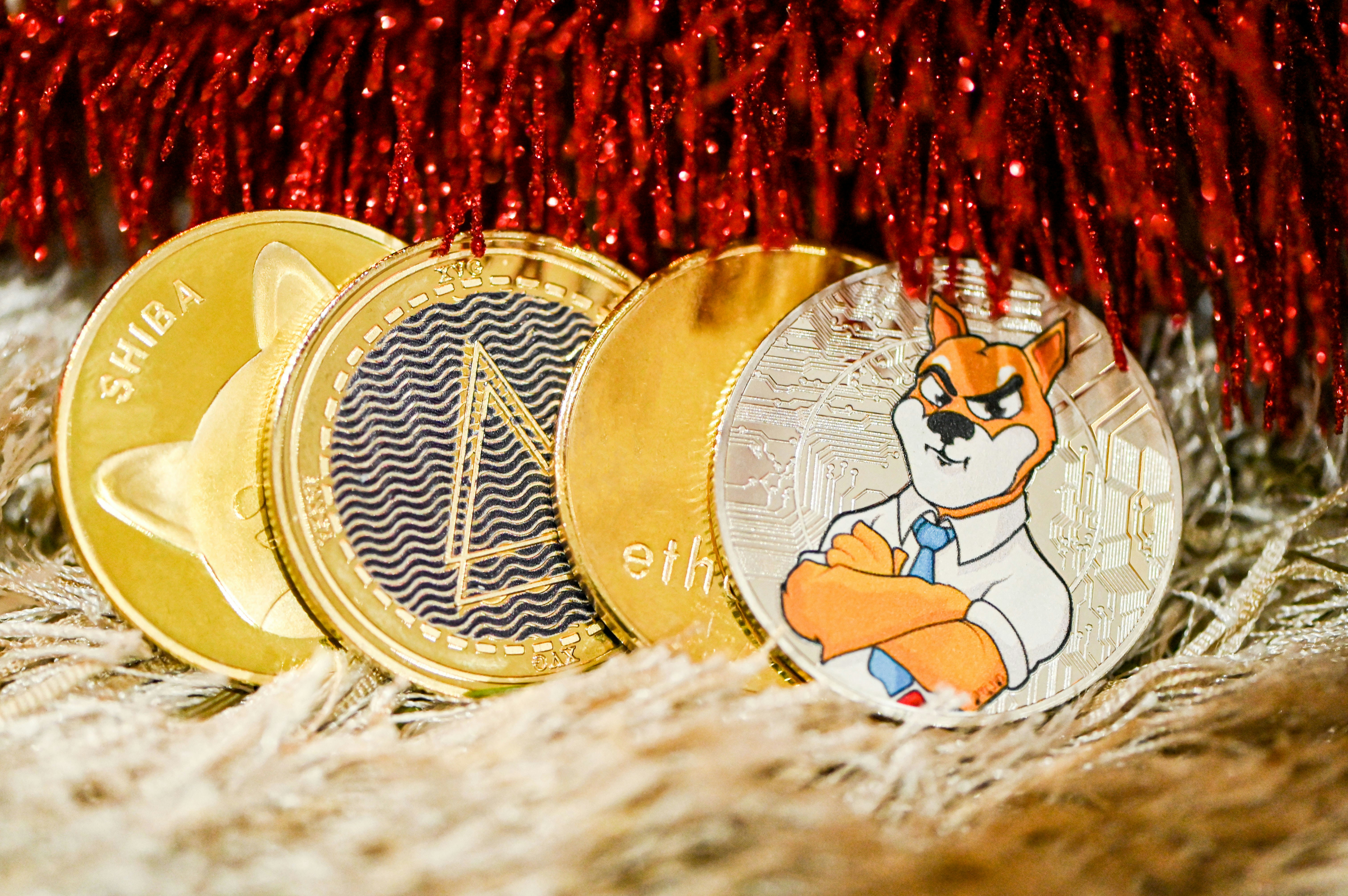 A pile of cryptocurrency coins on a soft carpet