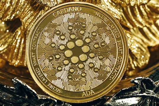 a gold coin sitting on top of a pile of gold foil