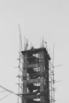 a tall tower with scaffolding on top of it