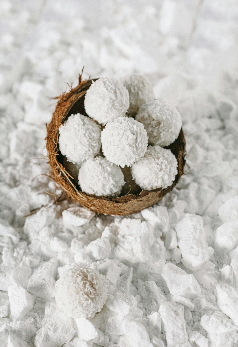 a coconut shell filled with powdered sugar