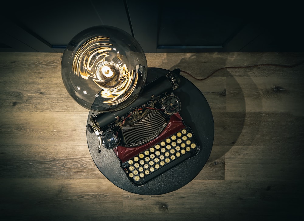 an old fashioned typewriter sitting on top of a table