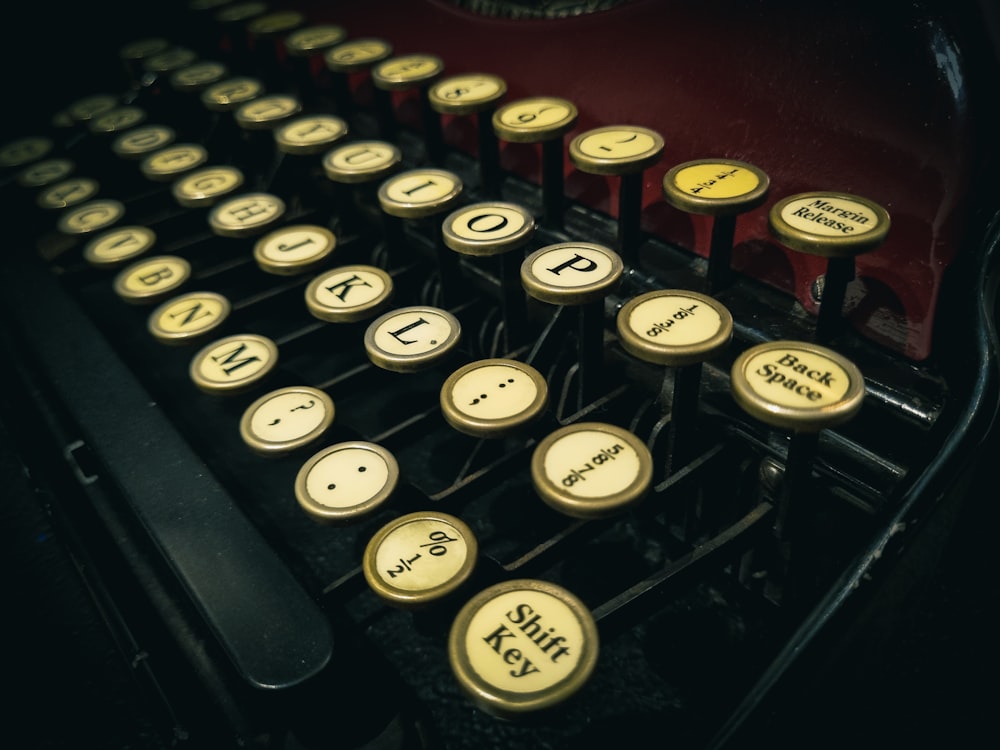 an old fashioned typewriter with yellow keys