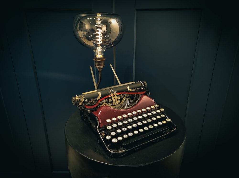 an old fashioned typewriter sitting on top of a table