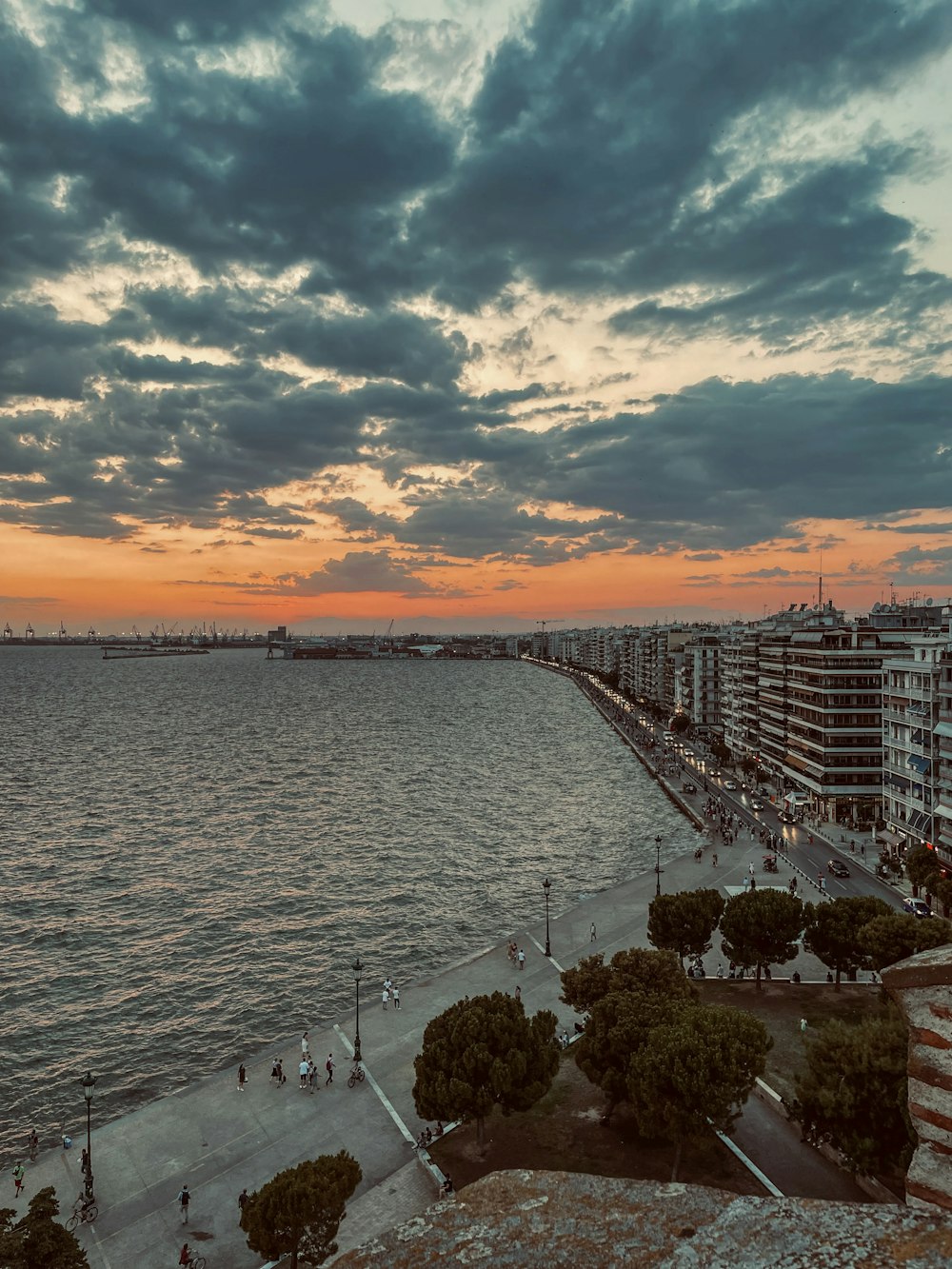 a sunset view of a beach and a body of water