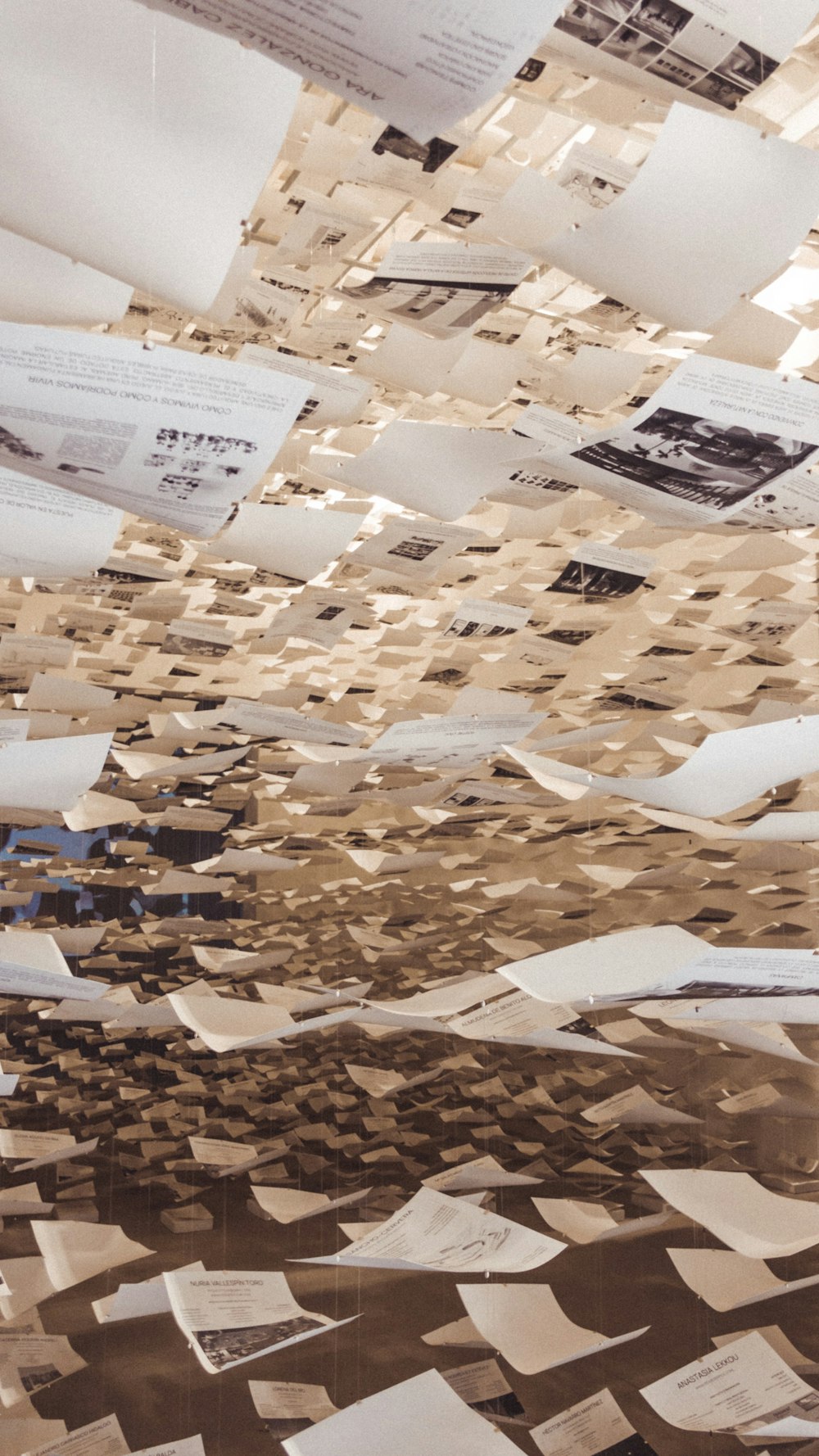 a room filled with lots of papers flying through the air