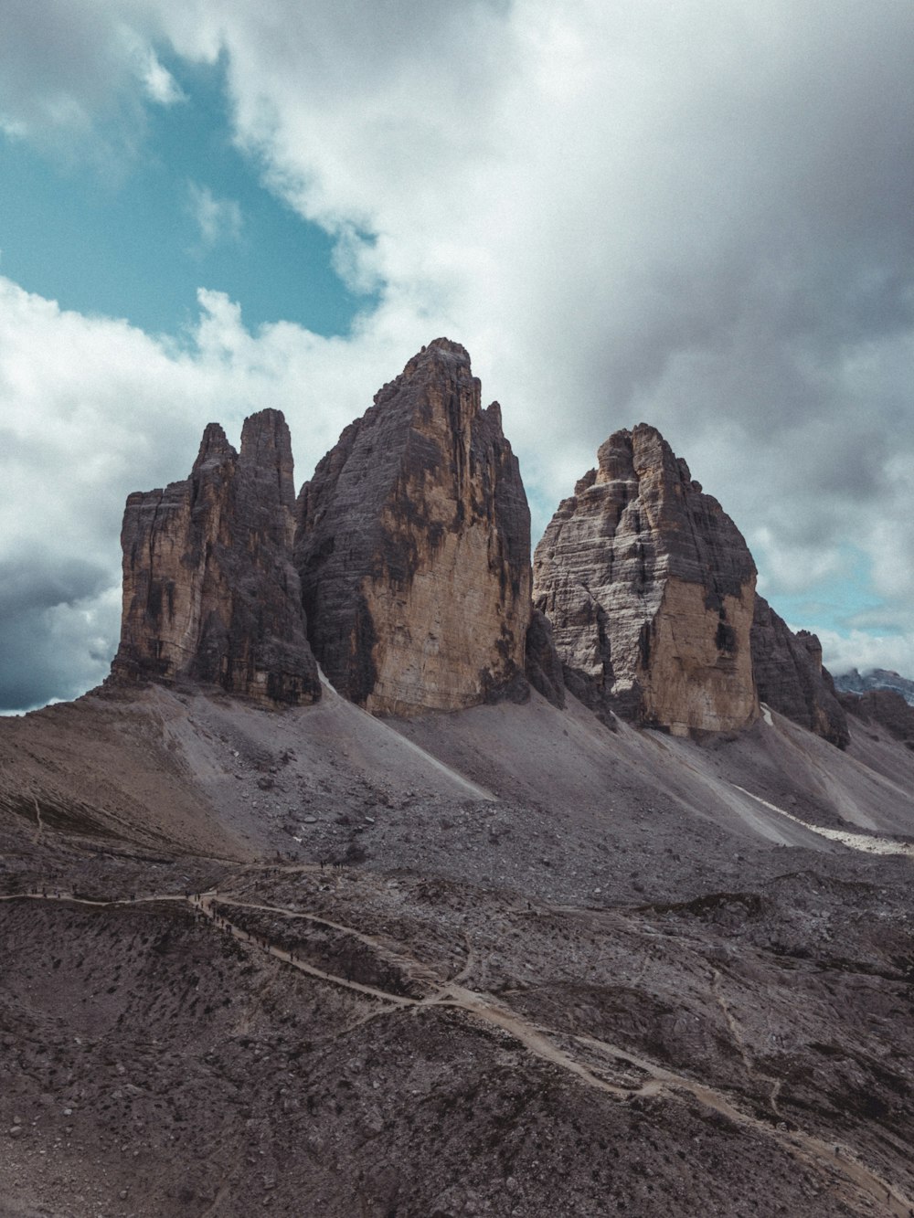 a group of mountains sitting in the middle of a desert