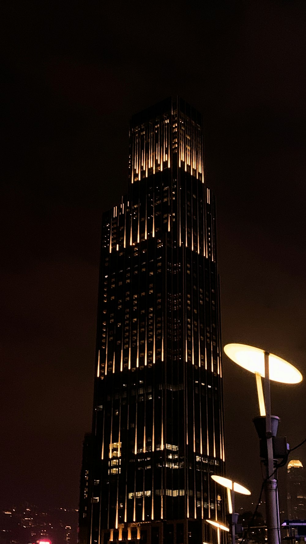 a very tall building lit up at night