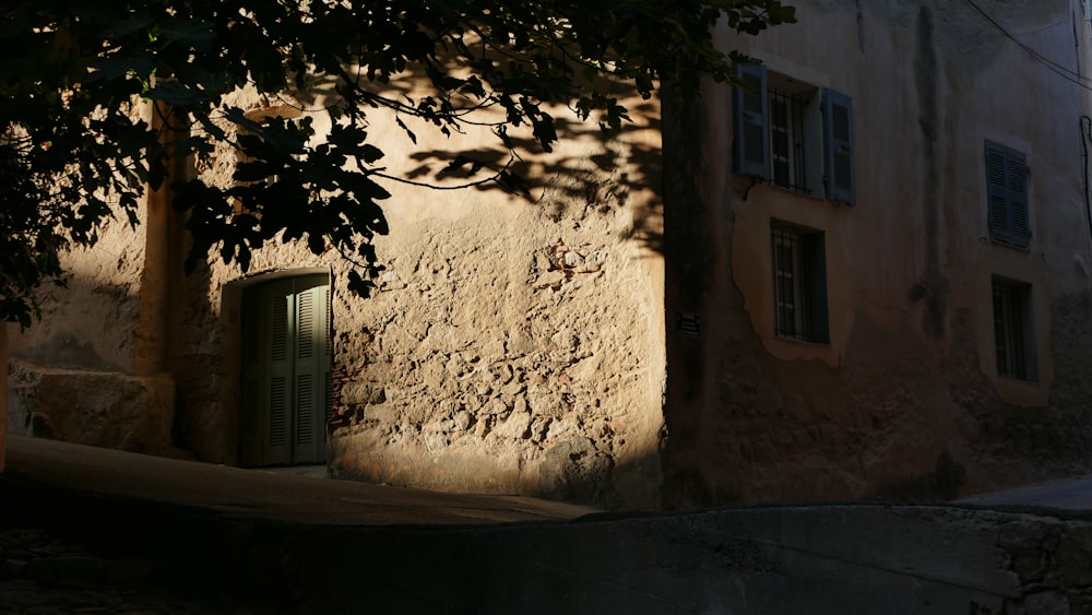 an old building with a door and a window