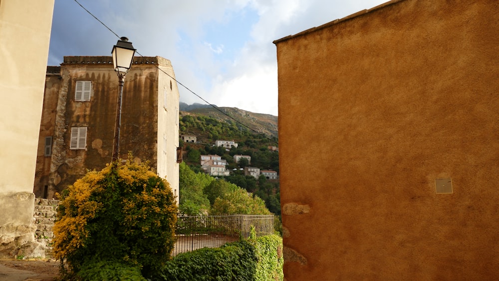 a view of a city from a narrow alley way