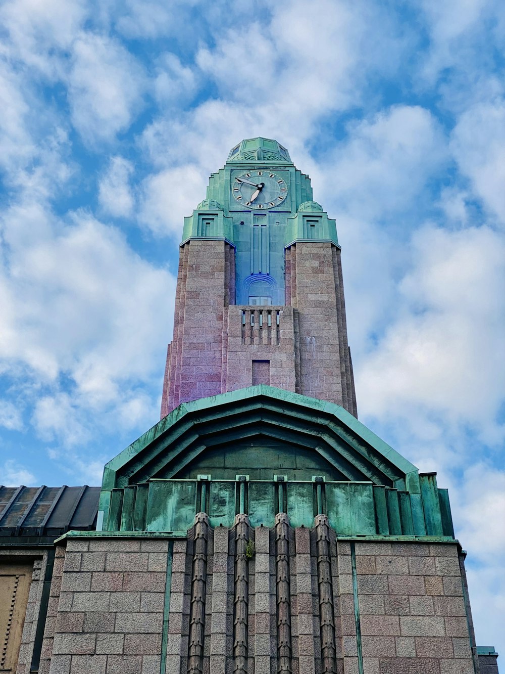 a tall building with a clock on the top of it