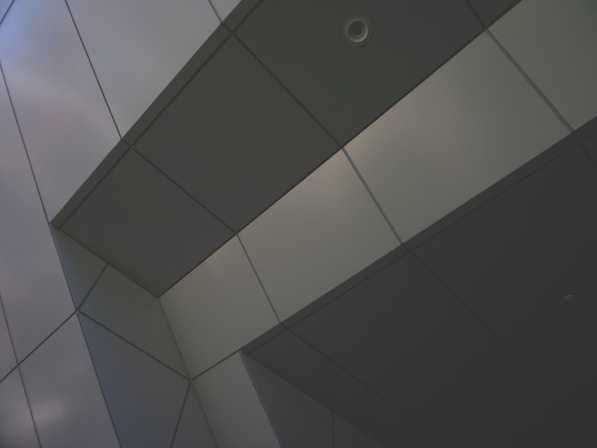 a close up of a building with a sky in the background