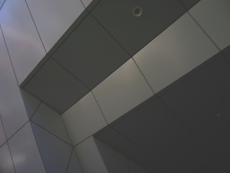 a close up of a building with a sky in the background