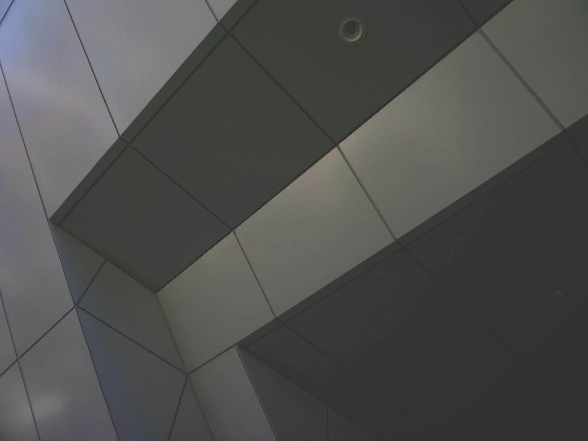 a close up of a building with a sky in the background