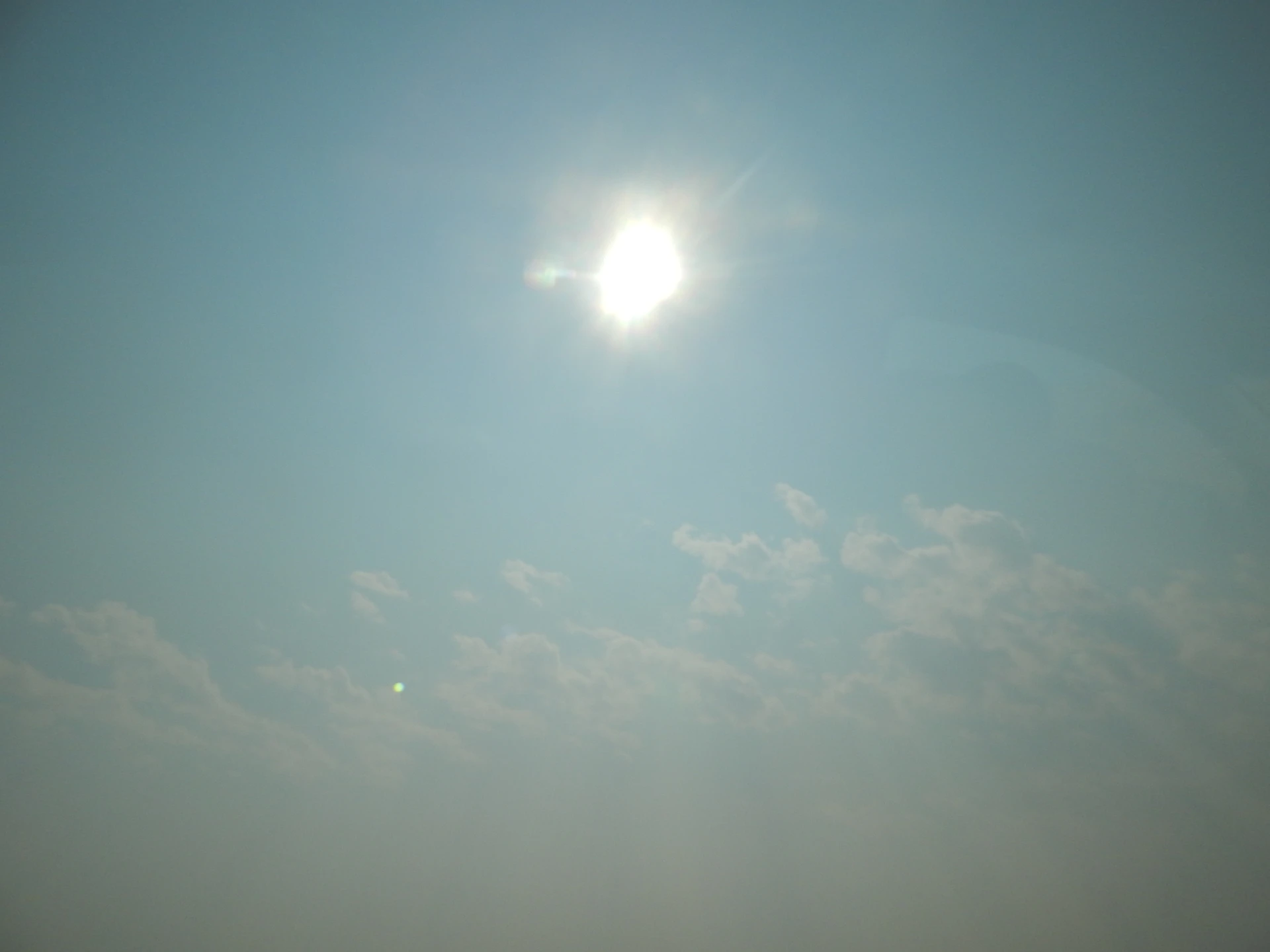 the sun is shining brightly in the sky