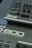 Close-up view of parts of Roland synthesizer models JD-08 and JD-800. The image features the control buttons, knobs, and sliders of the instruments along with the branding and model names on the panels.