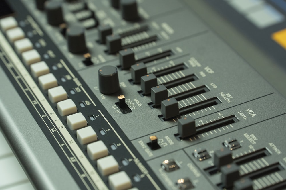 a close up of a control panel with buttons and knobs