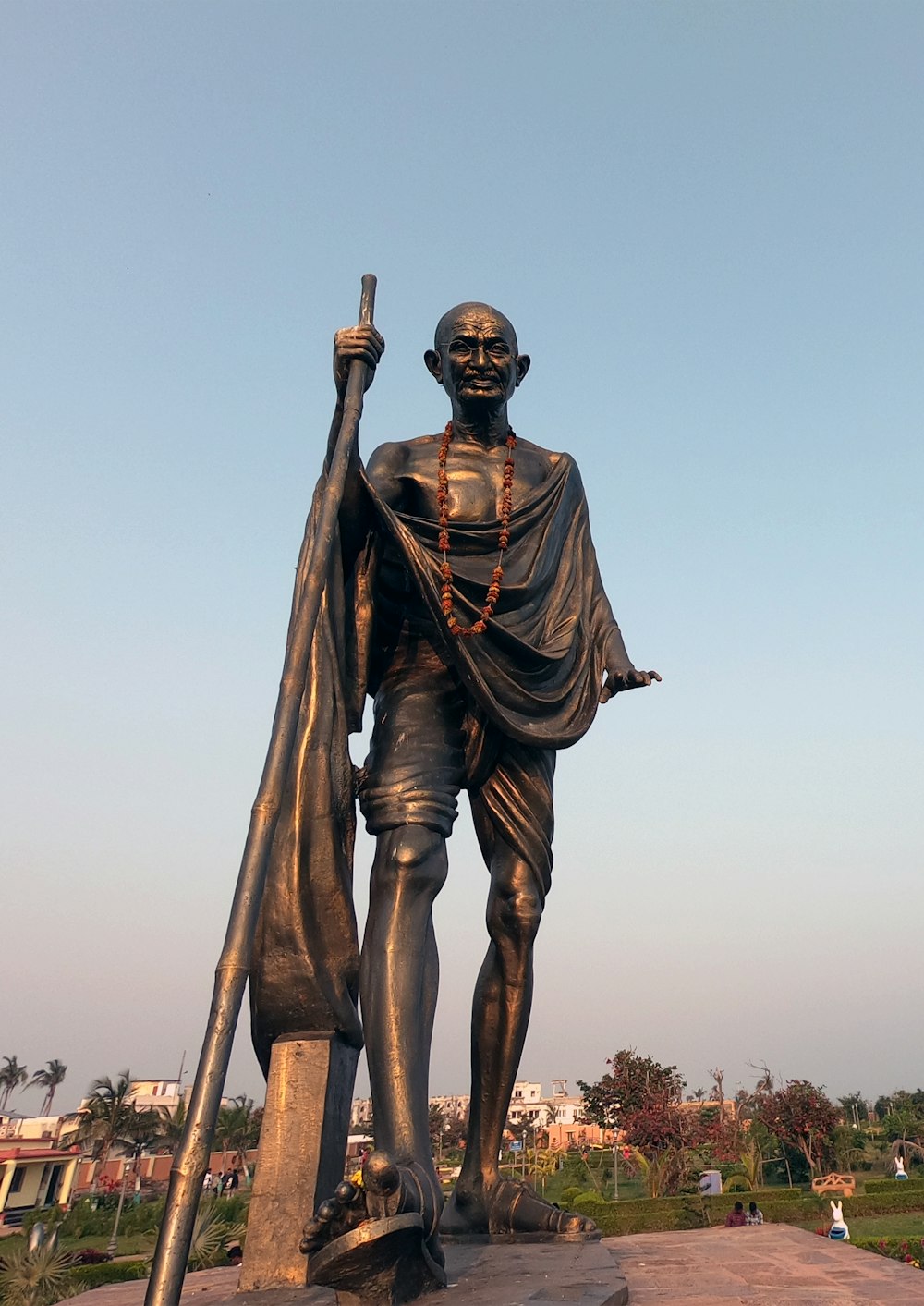 a statue of a man holding a flag