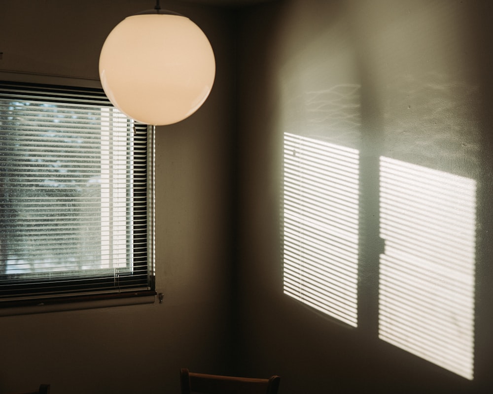 a room with a chair and a lamp in it