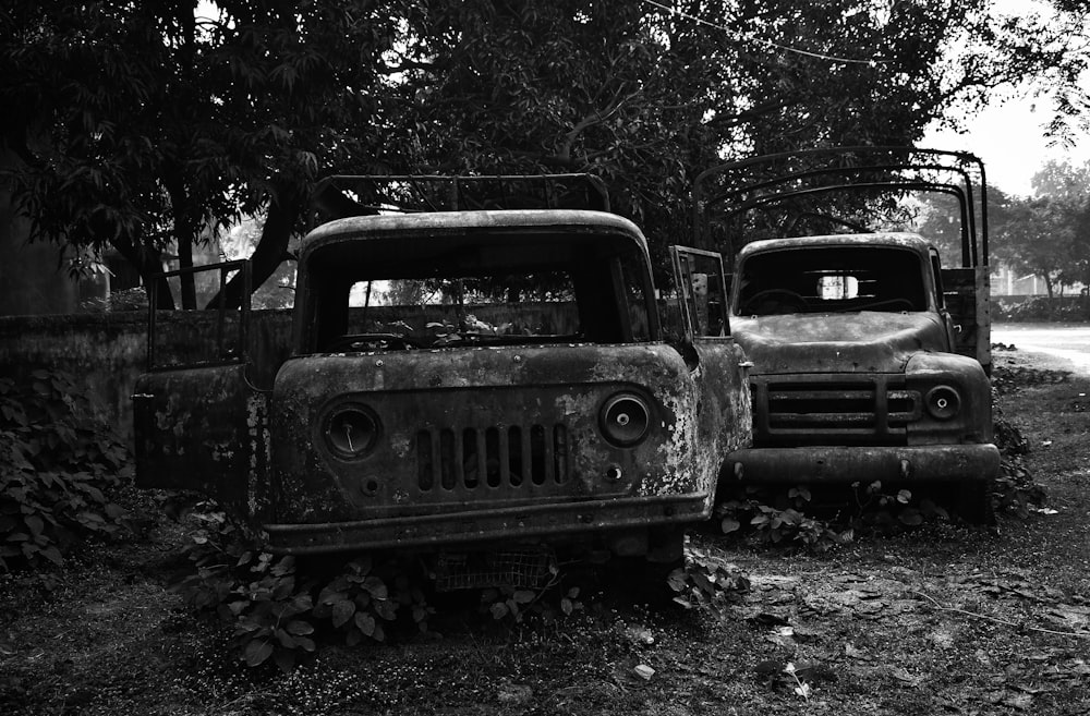 a couple of old trucks parked next to each other