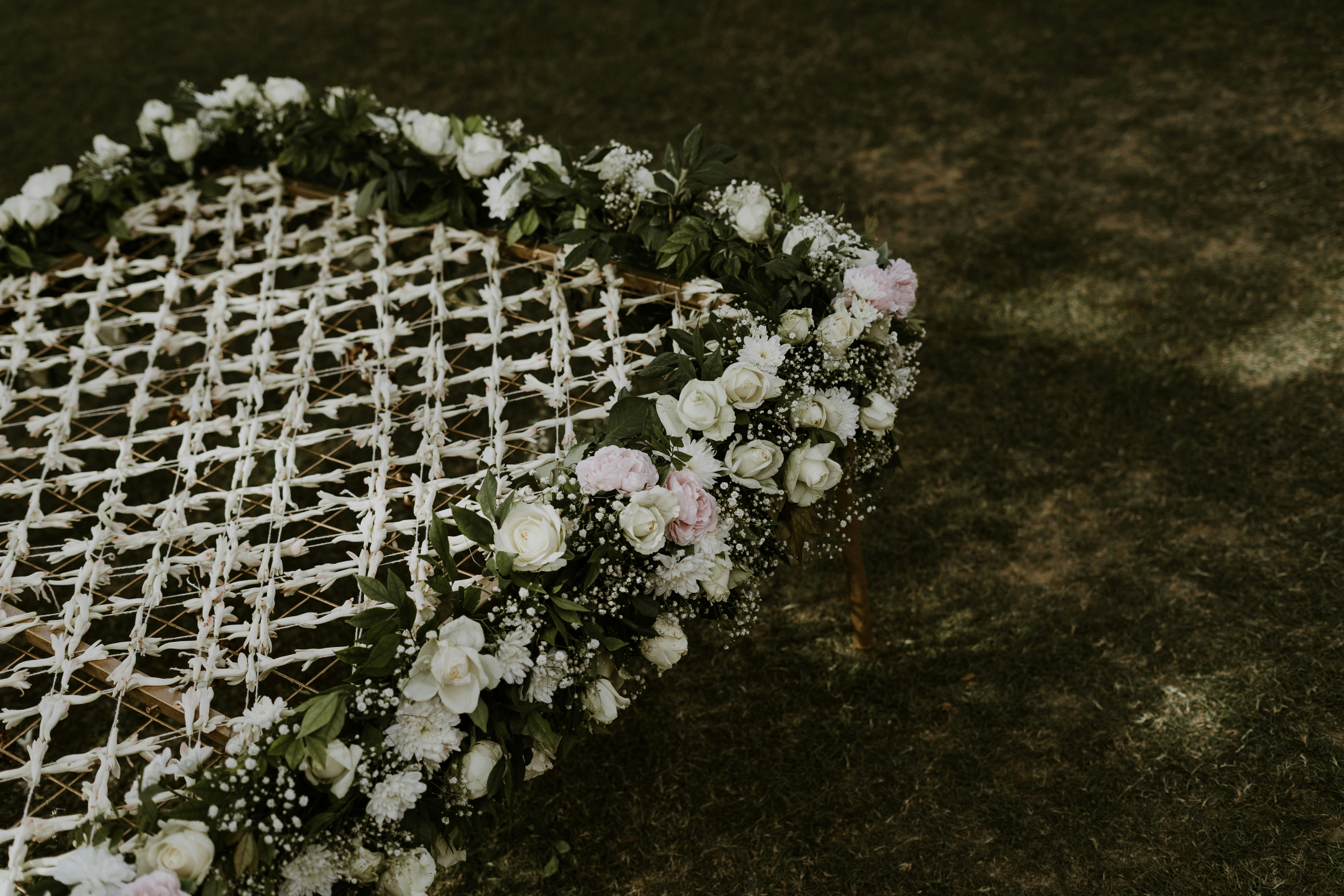 a close up of a chair with flowers on it