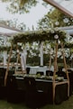 a wedding reception setup with black tables and white linens
