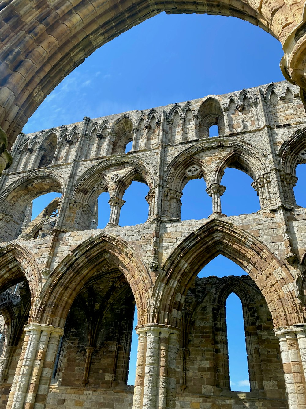 a large stone building with arches and arches