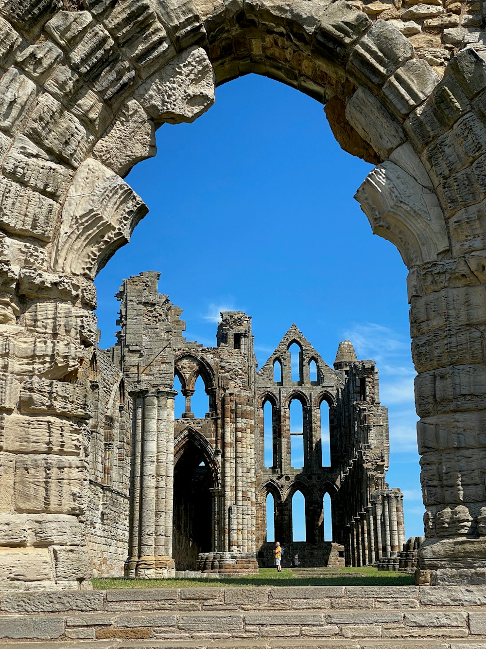 a large stone building with a stone archway