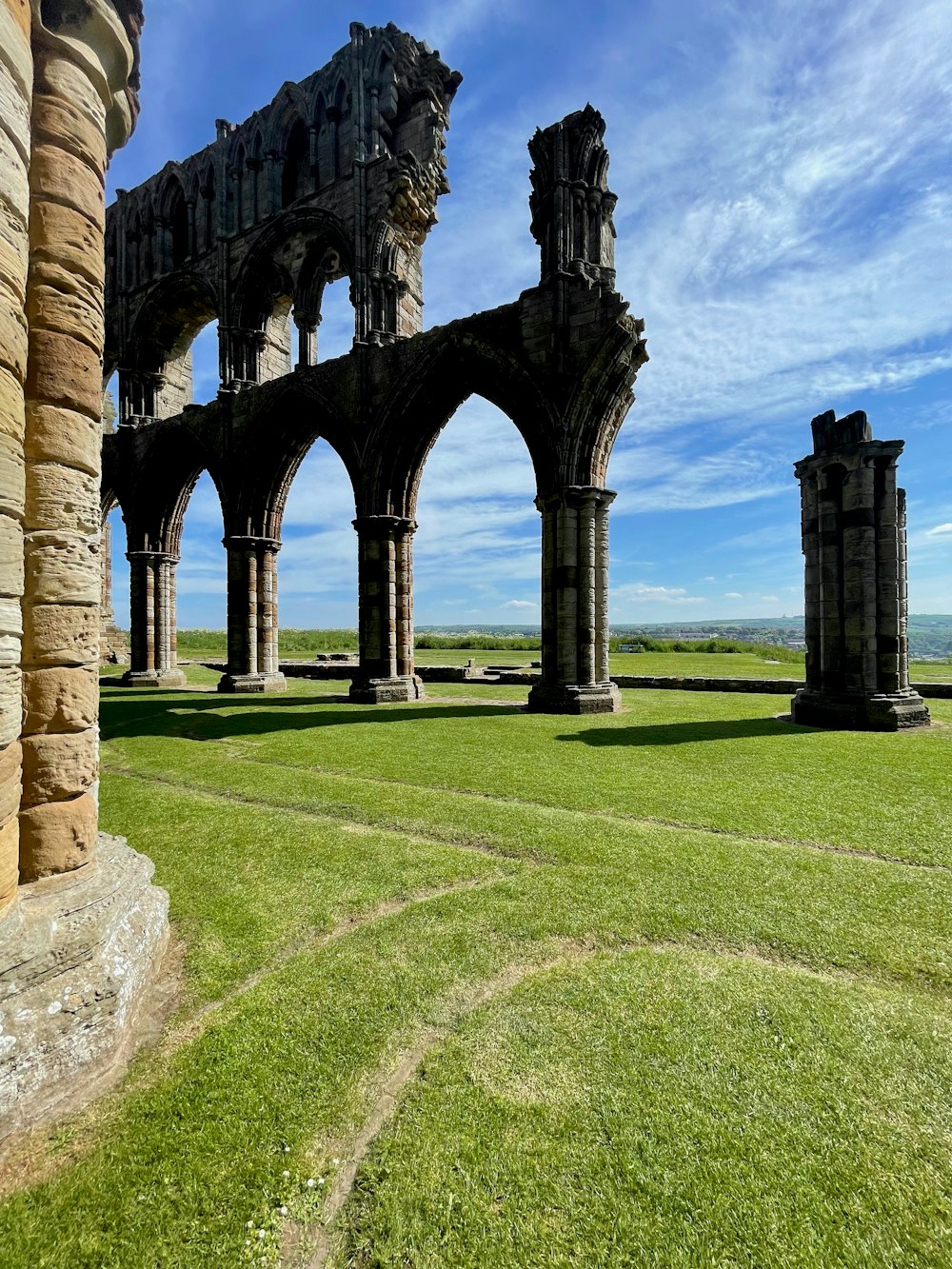 the ruins of an old building on a sunny day