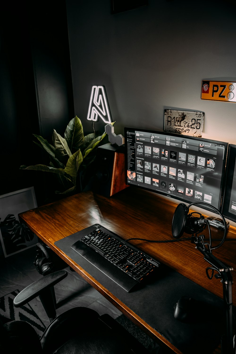 a desk with a keyboard, mouse and monitor