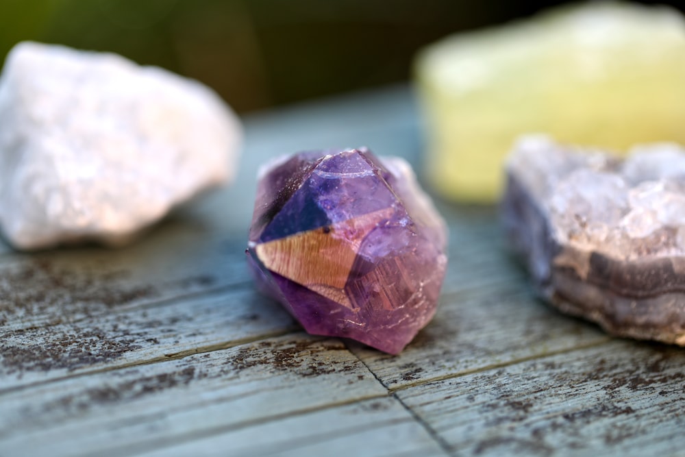 a group of rocks sitting on top of a wooden table