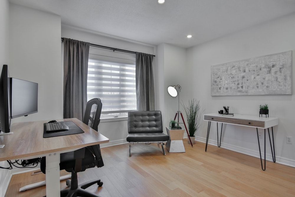 a home office with a desk, chair, and computer