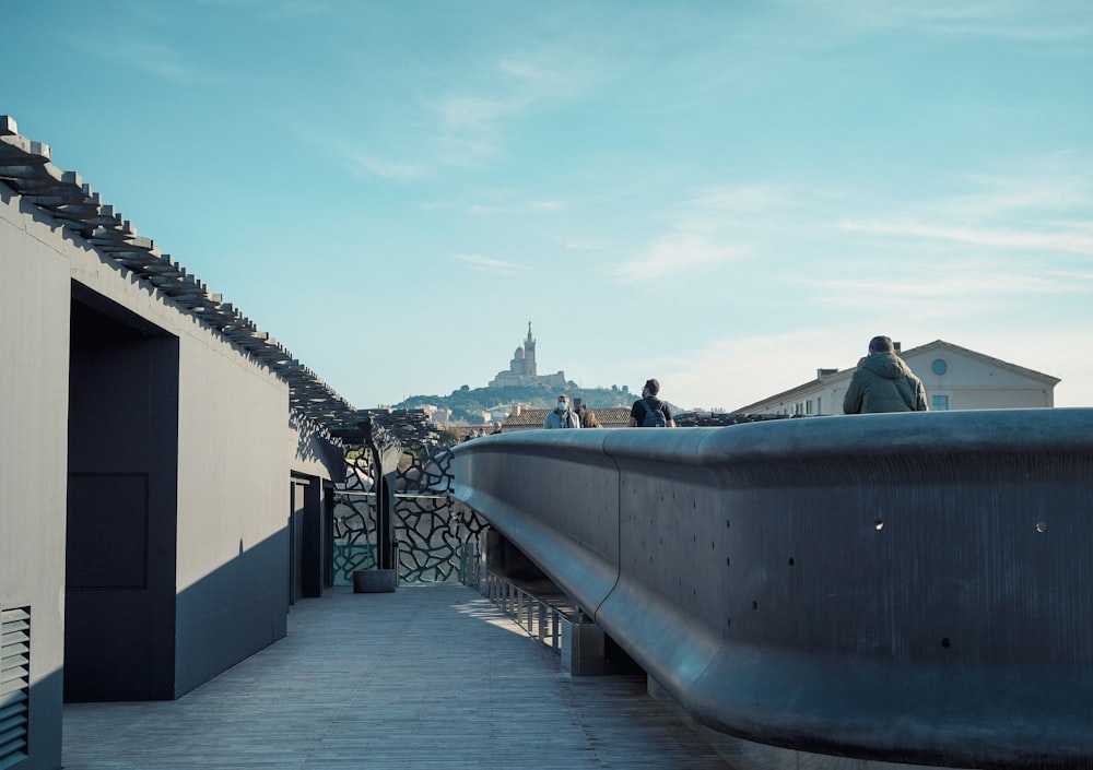 a man is standing on the roof of a building