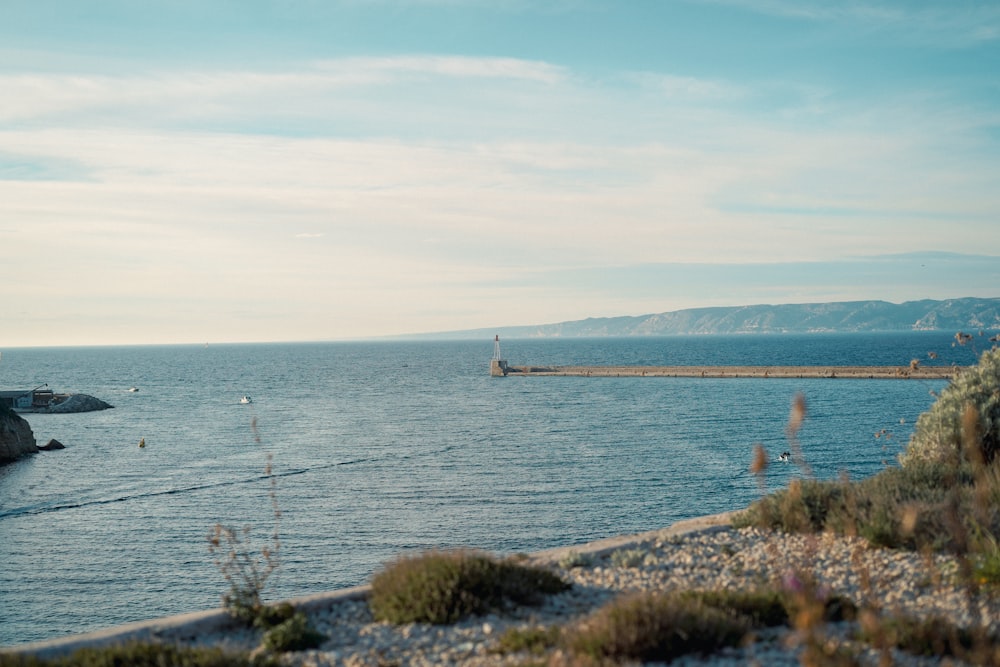 a body of water with a boat in the distance