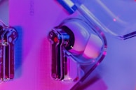 A close-up of Aobbow earbuds highlighting their smart sound technology.