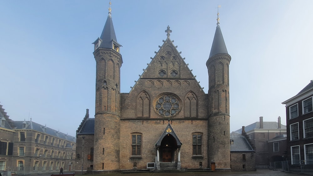 a large building with two towers and a clock