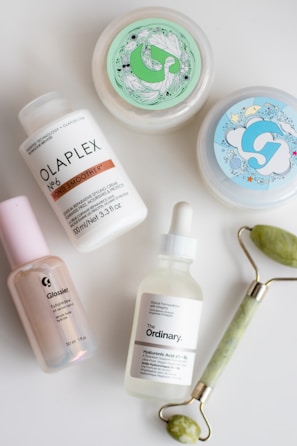 a white table topped with three different types of skin care products