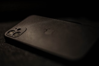 a close up of a cell phone on a table