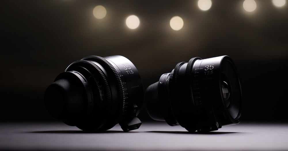 a couple of cameras sitting on top of a table