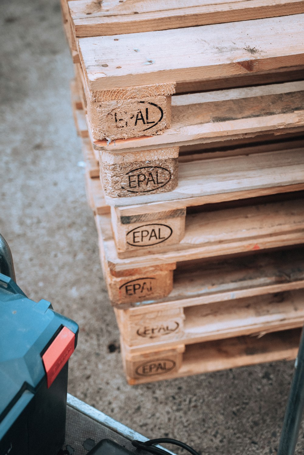 a pile of wooden pallets sitting on top of a floor