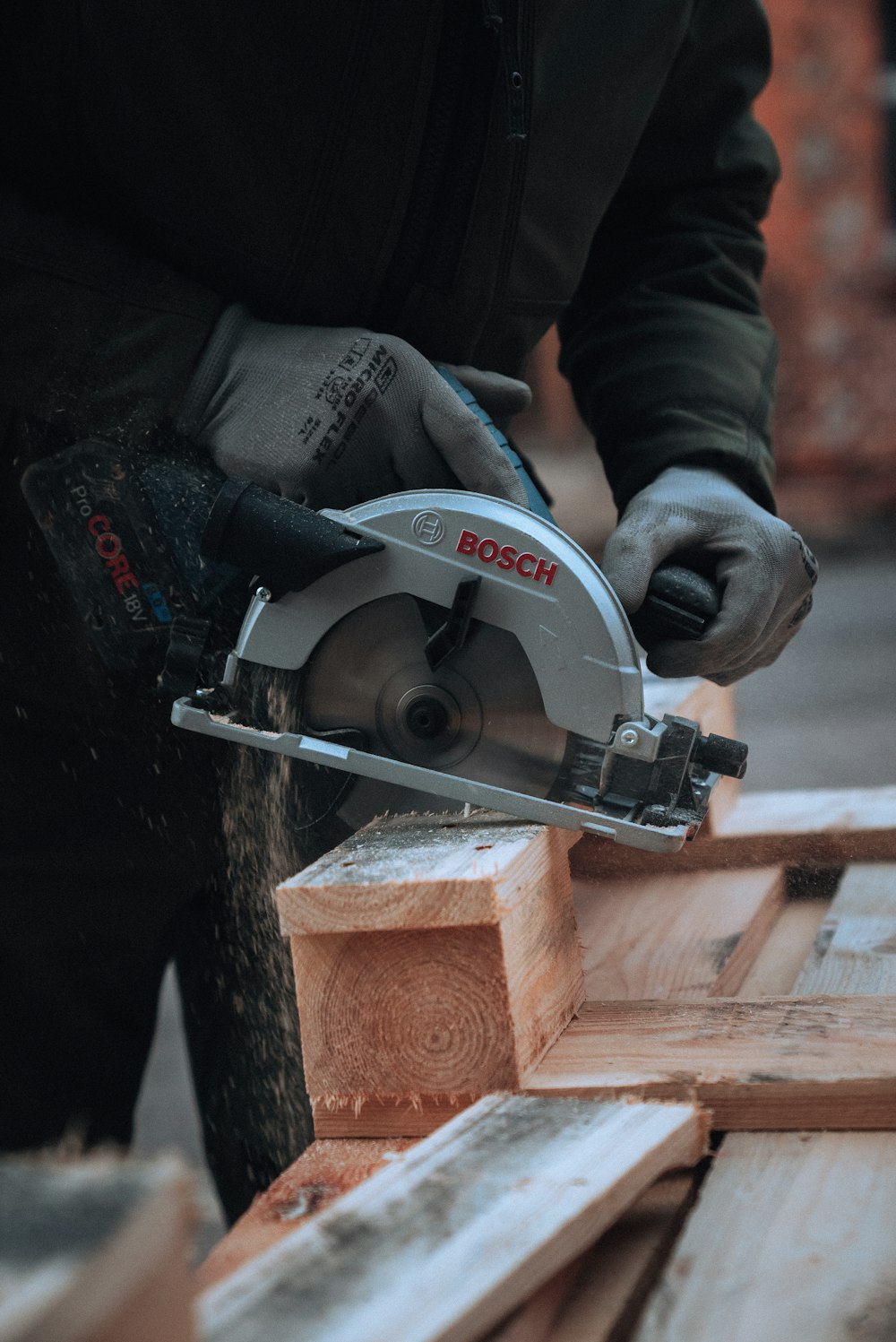 a man using a circular saw to cut wood