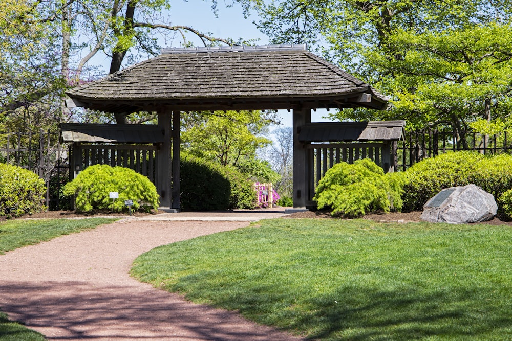 a gazebo in the middle of a grassy area