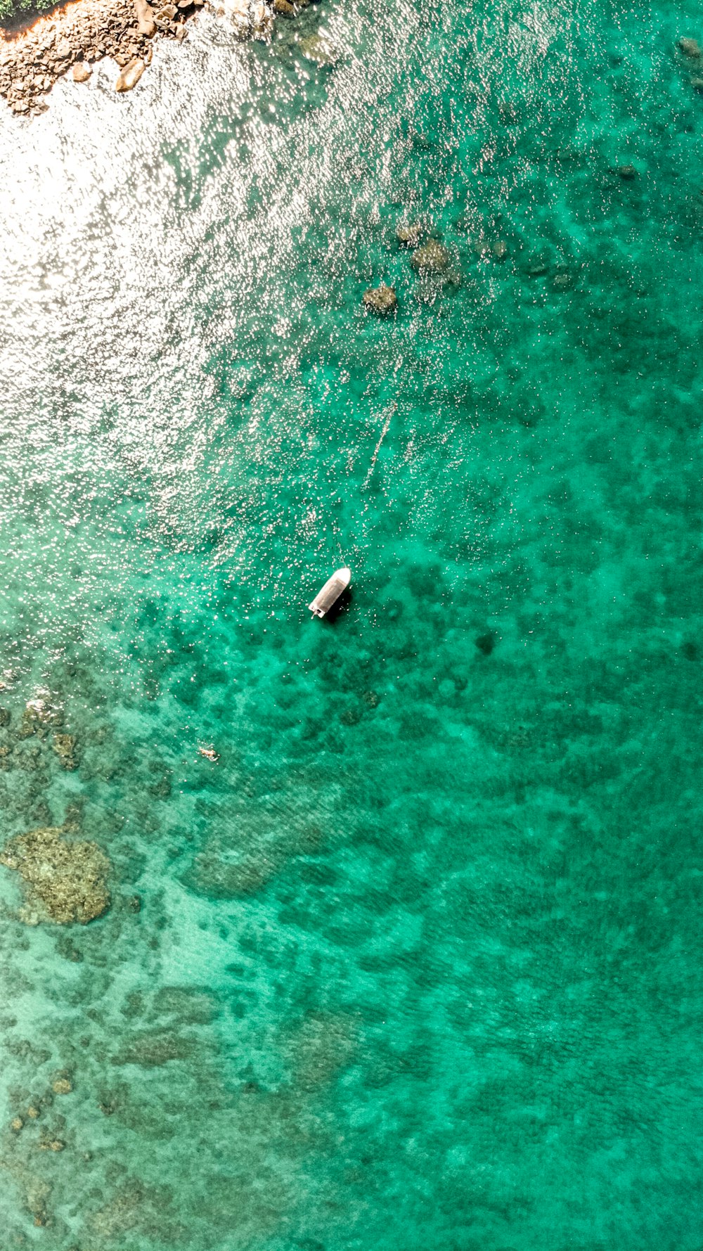 a boat floating on top of a body of water