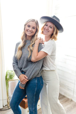 A cozy photo of Rich and Maria smiling warmly on a sunlit porch.