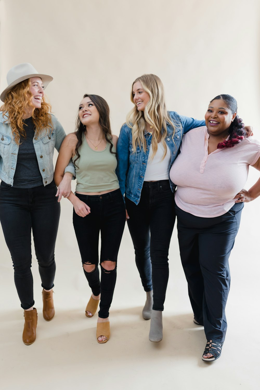 a group of women standing next to each other