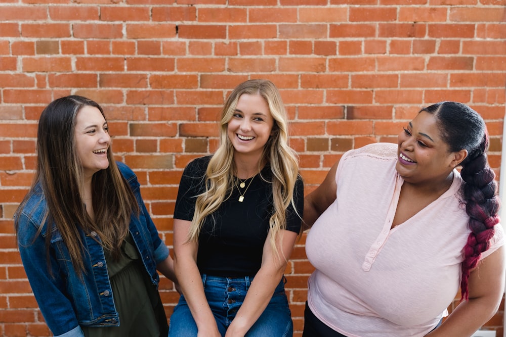 a group of women standing next to each other