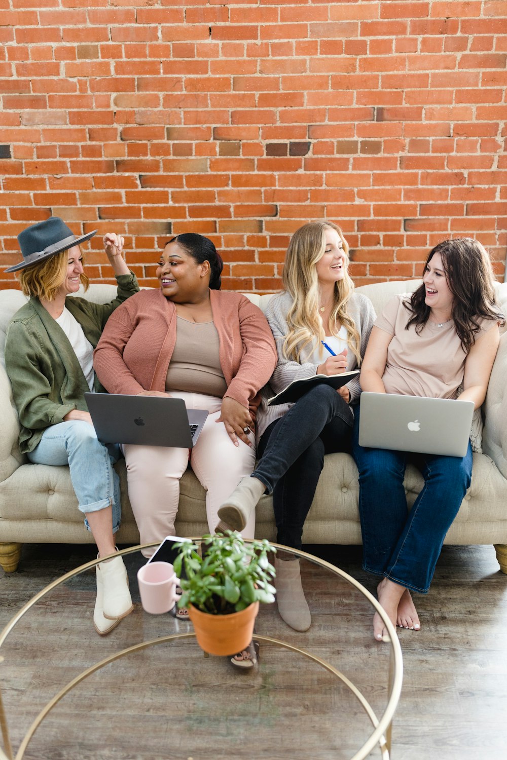 a group of women sitting on top of a couch