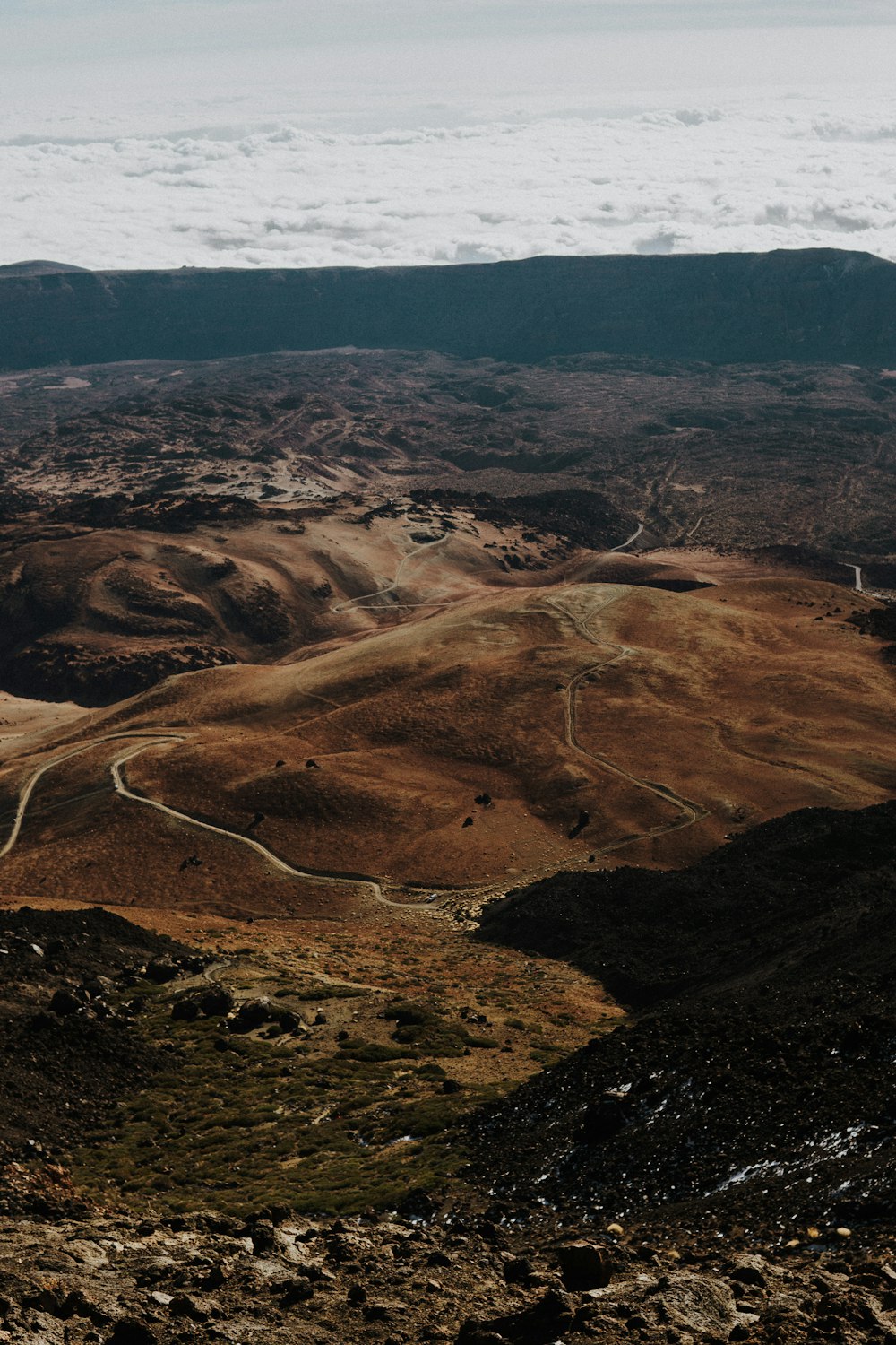 a view of a winding road in the mountains