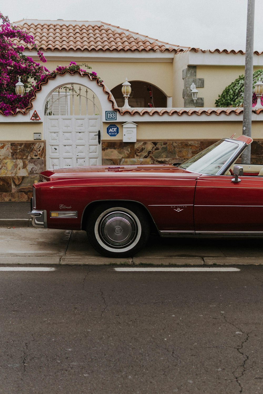 a red car parked on the side of the road